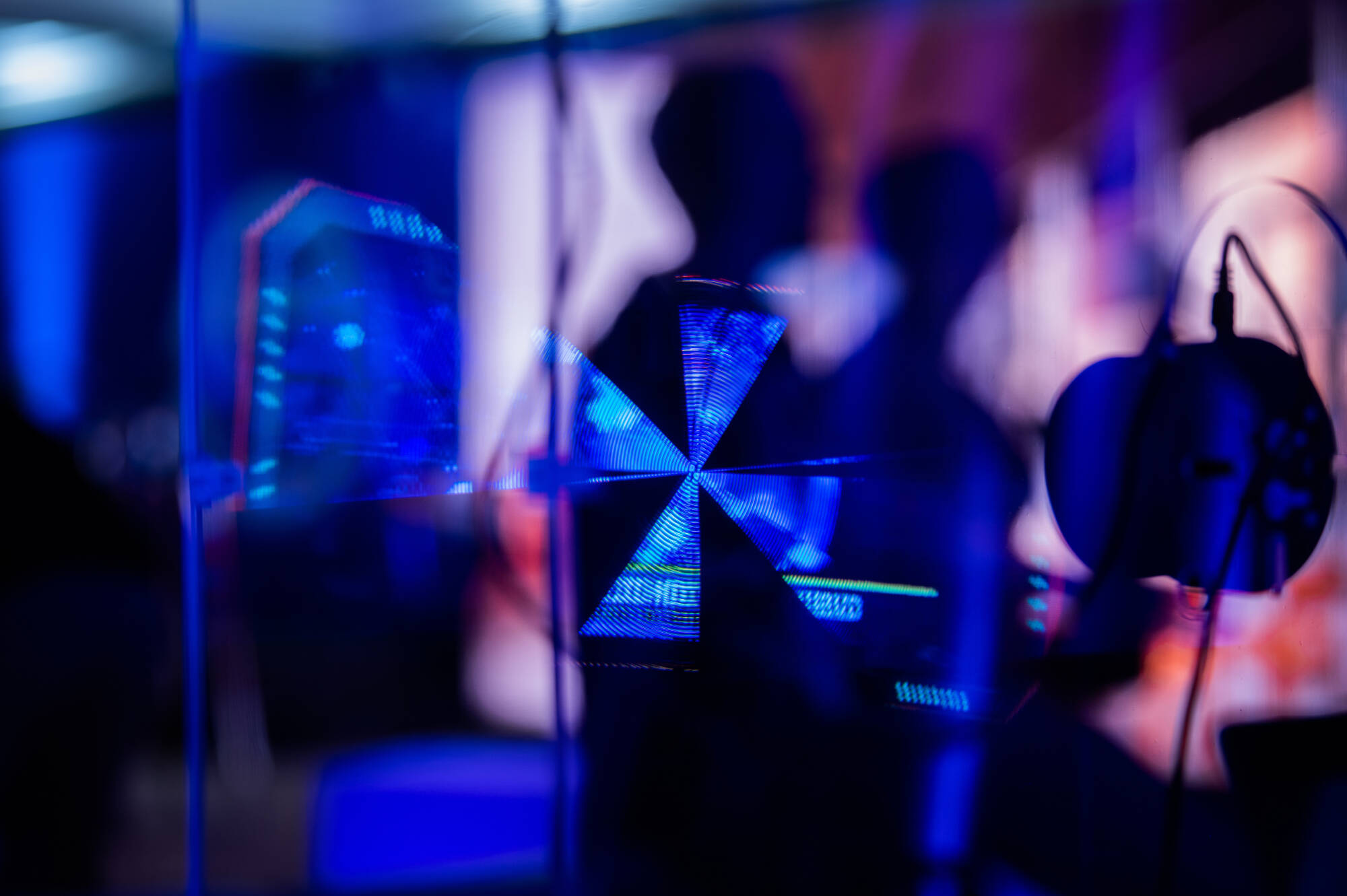 Glowing blue reflection of tech elements.